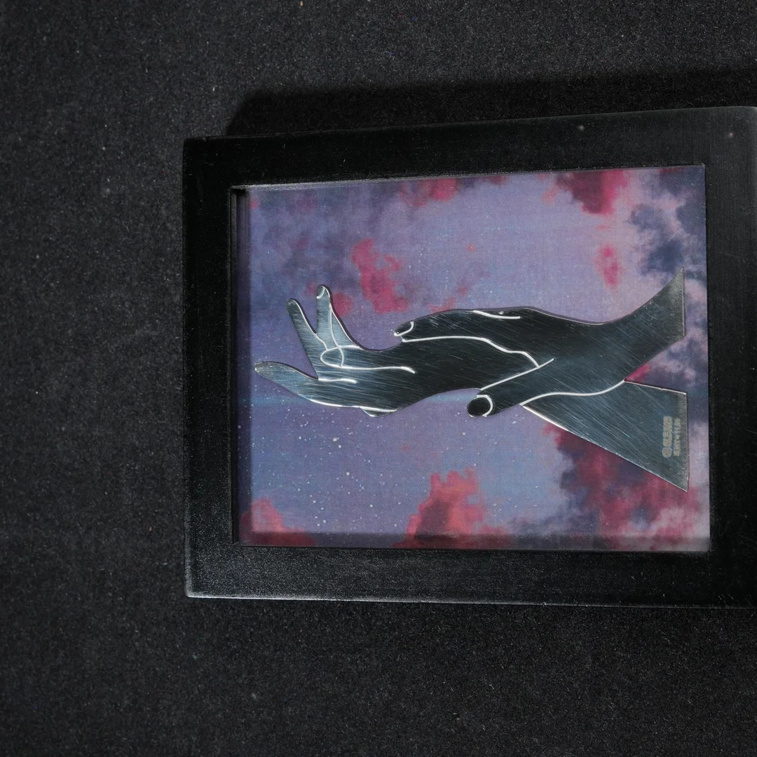 Two Hands With Purpel 999 Silver Frame